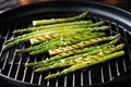 grill marks on asparagus stems in a grill wok