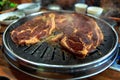 Grill meat on circle stanless pan Royalty Free Stock Photo