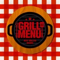 Grill menu. Best grilled dishes. Grill on a wooden stand on a red tablecloth