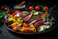 grill plate with juicy grilled beef and assortment of colorful vegetables Royalty Free Stock Photo