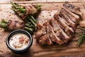 Grill pork steak with green beans with bacon on a board