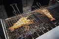 Grill prawn cooking seafood. Freshly grilled delicious lobsters. Lobster bbq. Royalty Free Stock Photo