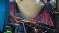 Grill the satay over a charcoal grill using a traditional bamboo fan Royalty Free Stock Photo