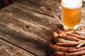 Grill sausages mix with beer, free space on wood Royalty Free Stock Photo