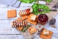 Grilled adyghe cheese, crackers, red jam, spices and cress salad on the wooden board Royalty Free Stock Photo