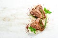 Grilled aged T-bone steak with rosemary on a white wooden background. Top view. Rustic style