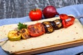 grilled appetizer with tomatoes, eggplant, courgettes, sweet peppers in restaurant serving