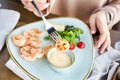 Grilled Argentine shrimp with mango-jalapeno sauce. Lunch in a restaurant, a woman eats delicious and healthy food