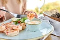 Grilled Argentine shrimp with mango-jalapeno sauce. Lunch in a restaurant, a woman eats delicious and healthy food