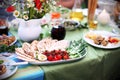 Grilled asparagus and tomatoes with pita bread on picnic table