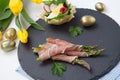 Grilled asparagus wrapped in prosciutto.