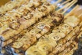 Grilled bananas on charcoal grill. Street food in thailand Royalty Free Stock Photo