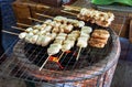 Grilled bananas using charcoal stove Royalty Free Stock Photo