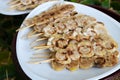 Grilled bananas on white plate