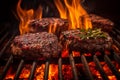 Grilled barbecue beef burgers prepared on BBQ fire flame grill Royalty Free Stock Photo