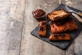 Grilled barbecue ribs on wooden table Royalty Free Stock Photo