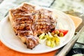 Grilled or barbecued Florentine steak on a plate Royalty Free Stock Photo