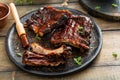 Grilled barbeque ribs with BBQ sauce and sides Royalty Free Stock Photo