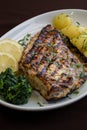 Grilled Bass with baked potatoes \