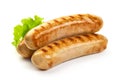 Grilled Bavarian sausages with green lettuce, isolated on white background Royalty Free Stock Photo