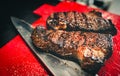 Grilled Bbq steak is waiting be sliced. Royalty Free Stock Photo
