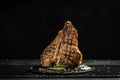 Grilled BBQ T-Bone Steak or porterhouse steak with Fresh Rosemary. American cuisine. Restaurant menu, dieting, cookbook recipe. Royalty Free Stock Photo