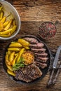 Grilled beef Rib Eye steak with garlic american potatoes rosemary salt and spices Royalty Free Stock Photo