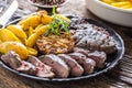 Grilled beef Rib Eye steak with garlic american potatoes rosemary salt and spices Royalty Free Stock Photo