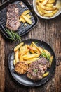 Grilled beef Rib Eye steak with garlic american potatoes rosemary salt and spices Royalty Free Stock Photo