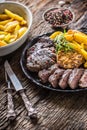 Grilled beef Rib Eye steak with garlic american potatoes rosemary salt and spices Royalty Free Stock Photo