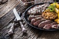 Grilled beef Rib Eye steak with garlic american potatoes rosemary salt and spices Royalty Free Stock Photo