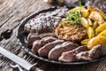 Grilled beef Rib Eye steak with garlic american potatoes rosemary salt and spices Royalty Free Stock Photo