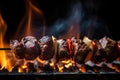 grilled beef shishkabob over open flame, with flames and smoke visible