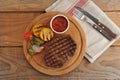 grilled beef steak, cut into pieces, grilled vegetables - zucchini, corn, onion, garlic, cherry Royalty Free Stock Photo