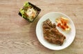 Grilled beef steak dressing gravy sauce with French fries dressing ketchup on plate and salad Royalty Free Stock Photo