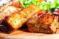 Grilled Beef steak with fresh vegetable salad, tomatoes and sauce on wooden cutting board Royalty Free Stock Photo