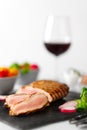 Grilled beef steak medium rare on stone board with fresh vegetables and glass of red wine. Royalty Free Stock Photo