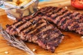 Grilled beef steak with grilled pepper, onion rings and tomatoes. Royalty Free Stock Photo