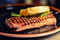 Grilled Beef Steak with Rosemary and Fried Onion Rings Royalty Free Stock Photo