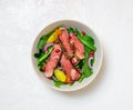 Grilled beef steak salad with arugula, potatoes, carrots, onions and pomegranate. Healthy eating. Diet Royalty Free Stock Photo