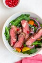 Grilled beef steak salad with arugula, potatoes, carrots, onions and pomegranate. Healthy eating. Diet Royalty Free Stock Photo