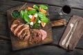 Grilled beef steak with salad, chimichurri sauce and red wine Royalty Free Stock Photo