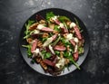 Grilled Beef Steak salad with pears, walnuts and greens vegetables and blue cheese sauce. healthy food. Royalty Free Stock Photo