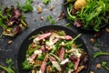 Grilled Beef Steak salad with pears, walnuts and greens vegetables and blue cheese sauce. healthy food. Royalty Free Stock Photo