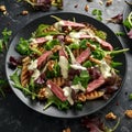 Grilled Beef Steak salad with pears, walnuts and greens vegetables and blue cheese sauce. healthy food. Royalty Free Stock Photo