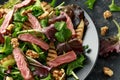 Grilled Beef Steak salad with pears, walnuts and greens vegetables and blue cheese sauce. healthy food. Royalty Free Stock Photo