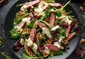 Grilled Beef Steak salad with pears, walnuts and greens vegetables and blue cheese sauce. healthy food. Royalty Free Stock Photo