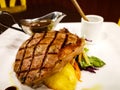 Grilled beef steak served with mashed potatoes and vegetables. Royalty Free Stock Photo