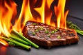 Grilled beef steak with vegetable on the flaming grill Royalty Free Stock Photo