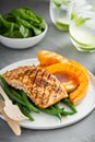 Grilled blackened salmon fillet with grilled squash Royalty Free Stock Photo